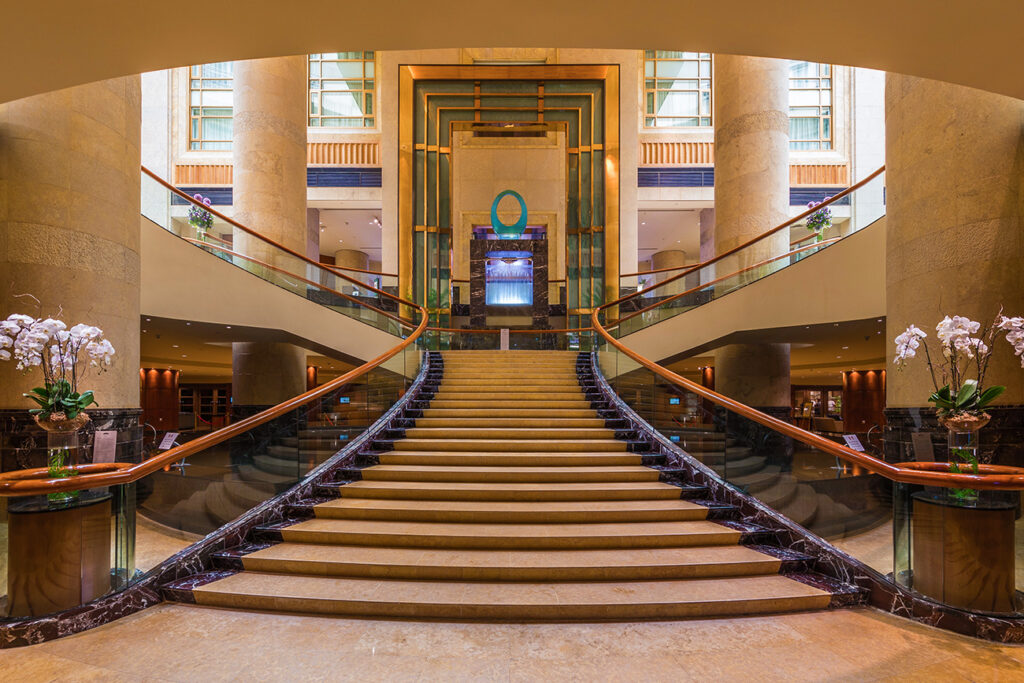 Symmetric view of the staircase at The Fullerton Hotel Singapore